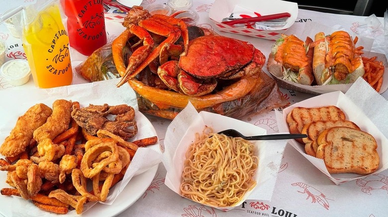 A variety of seafood dishes and sides at Cap't Loui