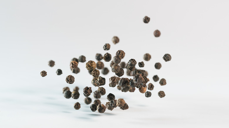 black peppercorns isolated on white background