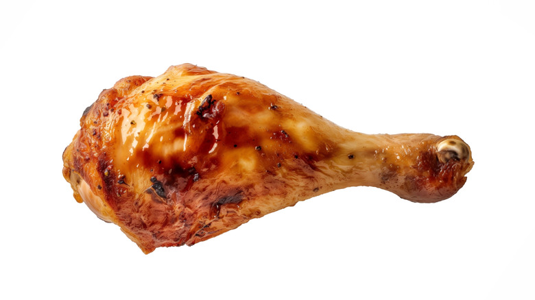 wrinkled looking drumstick coated in sauce