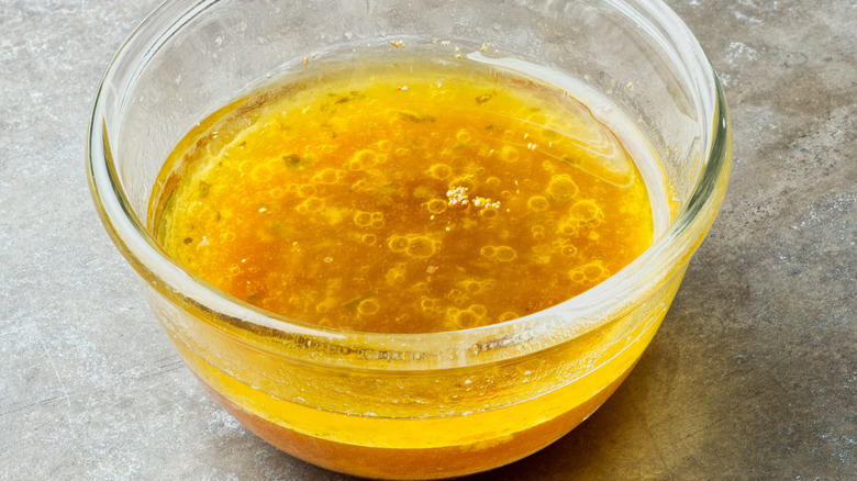 oil and drippings in a glass bowl