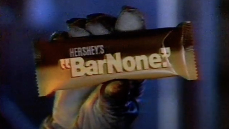Hand holding Hershey's BarNone candy bar