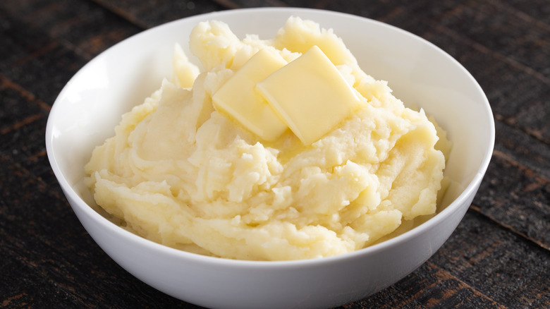 Bowl of mashed potatoes with butter