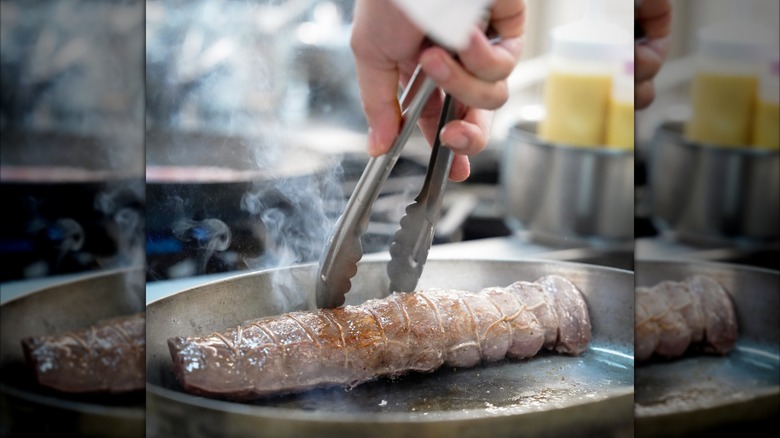 Searing pork tenderloin in a pan