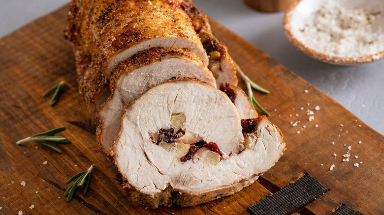 Studded pork tenderloin with apples and herbs