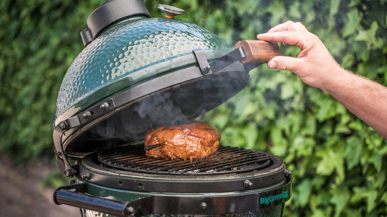 Big Green Egg with lid partially closed