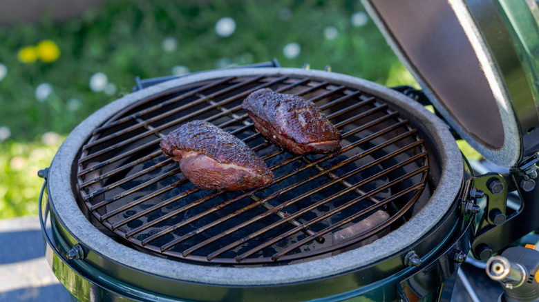 Duck breasts cooking on direct heat on Big Green Egg
