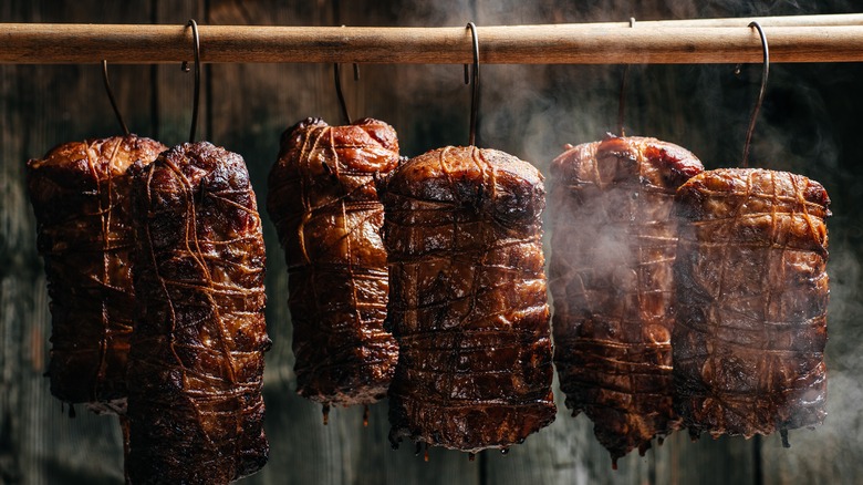 Ham hanging in a smokehouse