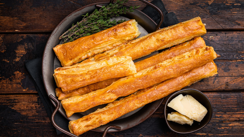 Breadsticks in skillet with cheese and herbs
