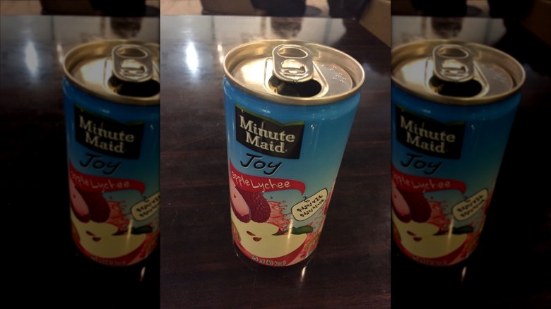 can of Minute Maid Joy Apple Lychee on brown wooden table