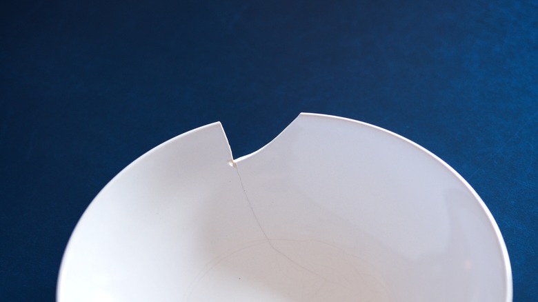 chip in porcelain dish on dark background