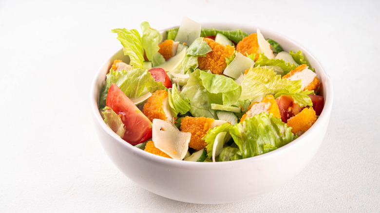 Chicken nuggets mixed into a salad