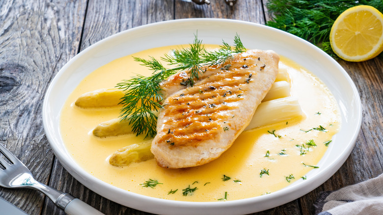 grilled chicken on asparagus and hollandaise