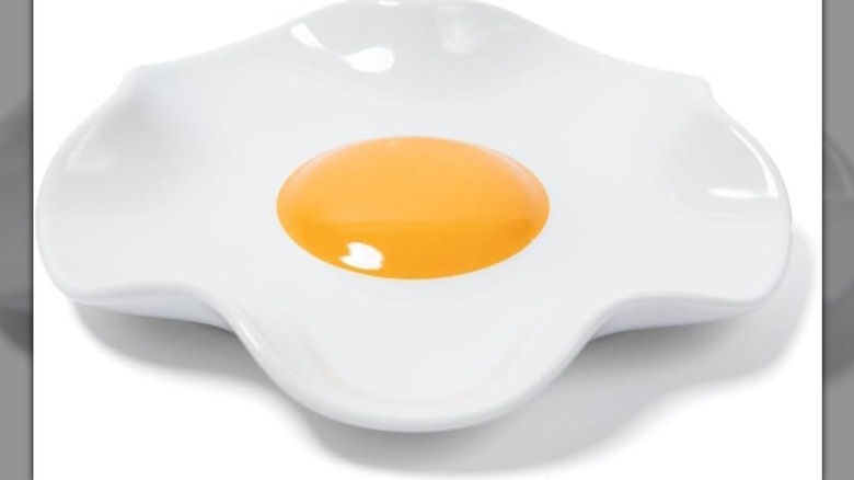 Fried egg spoon rest with raised edges and a yellow center