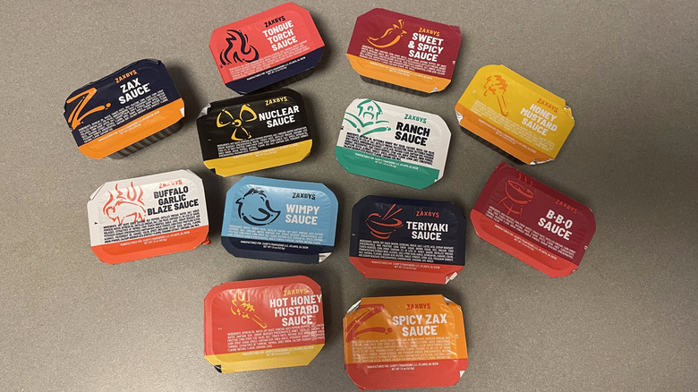 12 Zaxbys sauces on a gray countertop