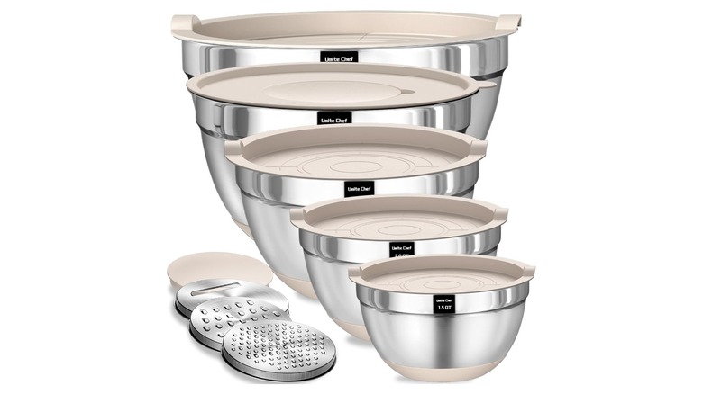 five silver mixing bowls with lids