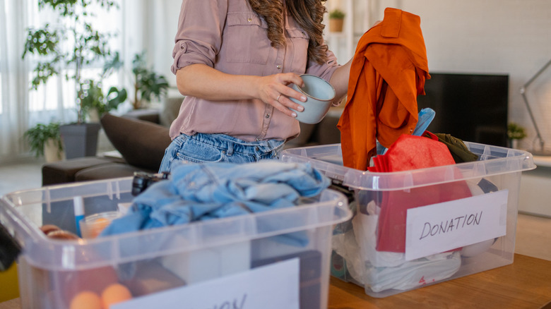 A woman preparing items for donation