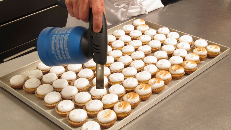 Pastry chef using a kitchen torch