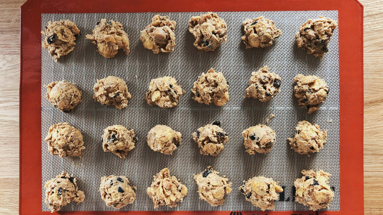 Silicone baking mat with cookie dough