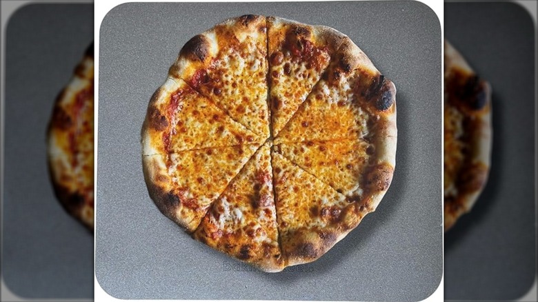 Baking Steel Original baking steel with a pizza on top