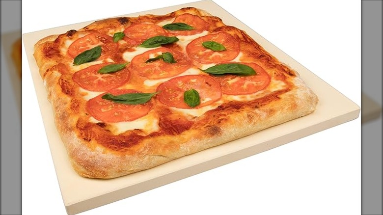 CucinaPro baking stone with pizza