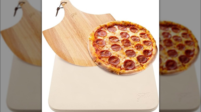 Hans Grill pizza stone and peel on a white surface
