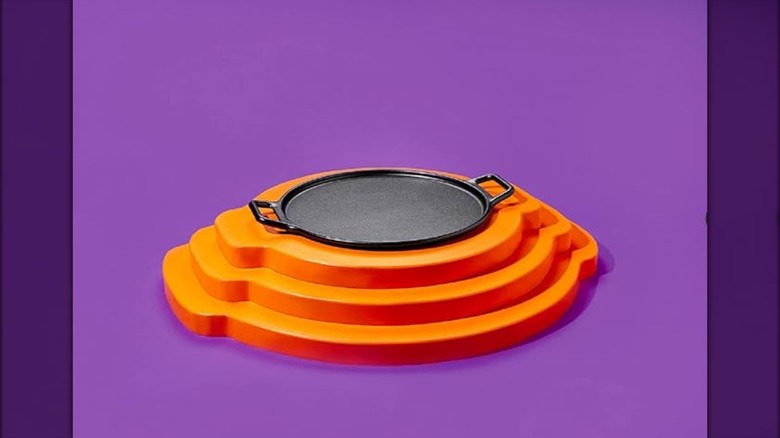 Lodge cast iron pizza pan on an orange stand