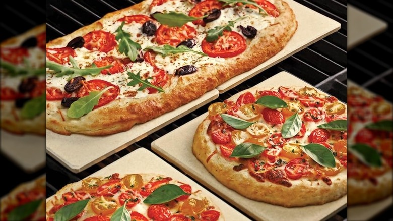 Outset stone tiles on grill with pizza