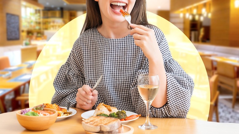 Person eating meal in a dining room
