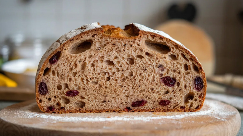 A loaf of Kirkland cranberry walnut bread on a cutting board