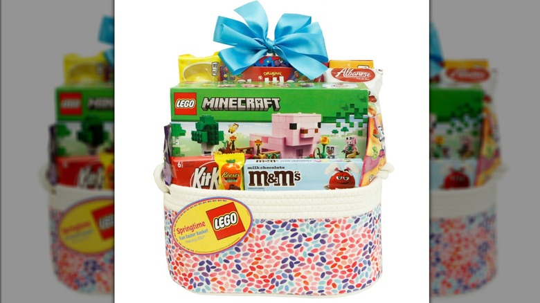 A LEGO gift basket for Easter stuffed with candy and toys.