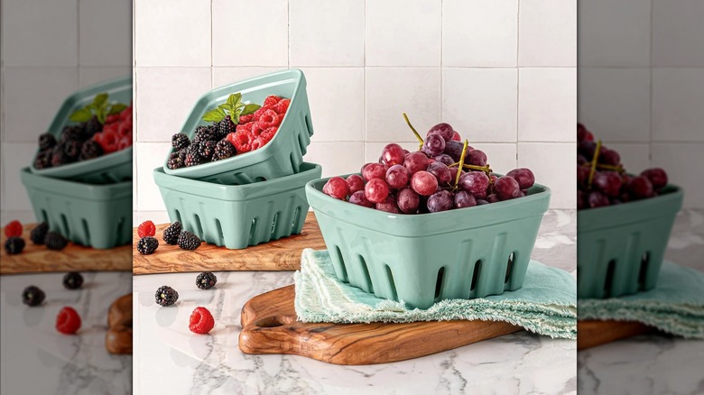 Three over&back Multipurpose Berry Baskets sitting on a countertop with fresh berries in them.