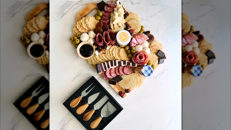 The Platterful charcuterie kit with its contents laid out sitting on top of a countertop.
