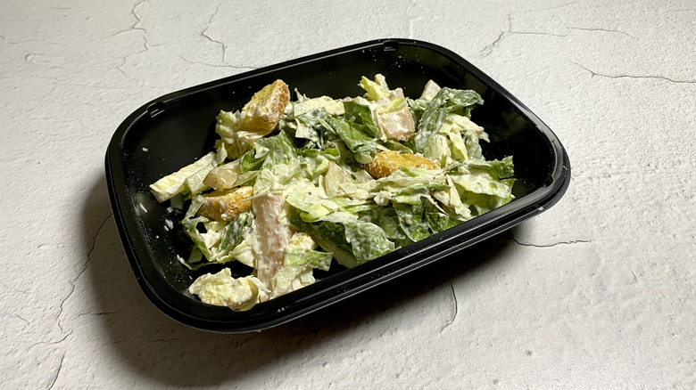 Applebee's Caesar Salad in a takeout container