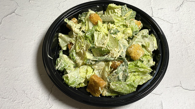 Outback Steakhouse's Caesar Salad in a takeout container