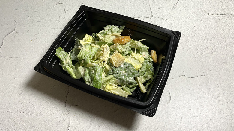 BJ's Caesar Salad in a takeout container
