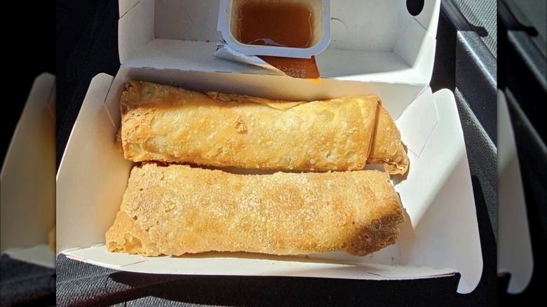Egg rolls in a takeout container from Jack in the Box