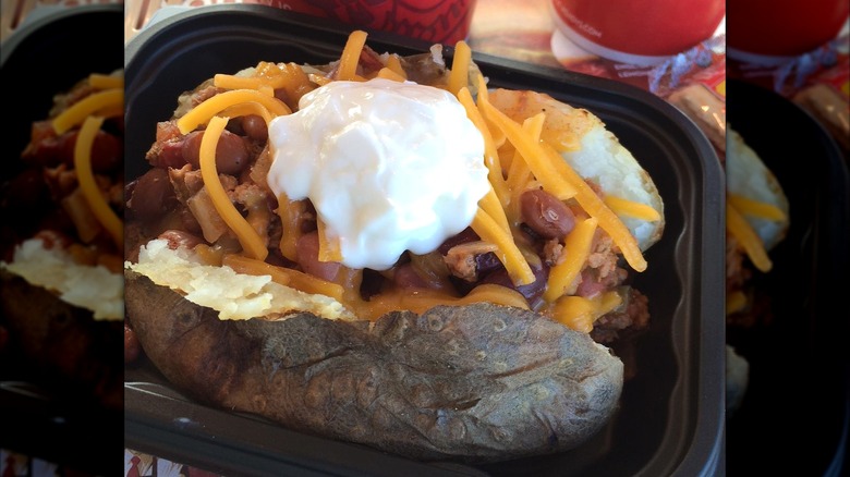 A baked potato with cheese, bacon, and sour cream from Wendy's