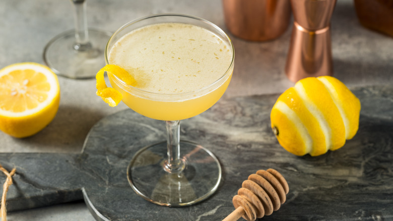 Fresh Bee's Knees cocktail with lemon and honey