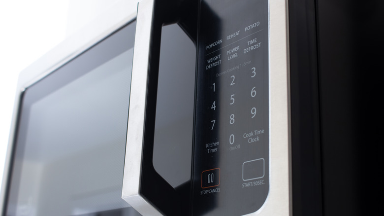 Buttons on the outside of a microwave