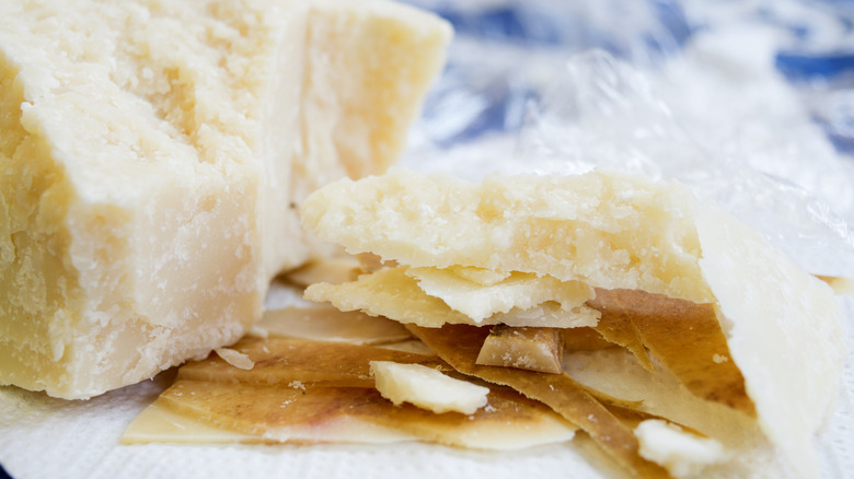 Cheese rinds stacked on white background
