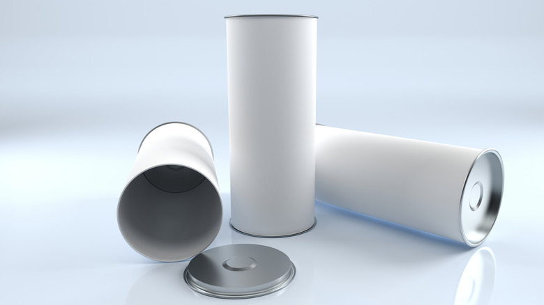 Three Pringles cans wrapped in white paper