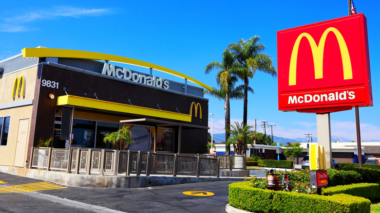 exterior of Mcdonald's restaurant against a bright blue sky