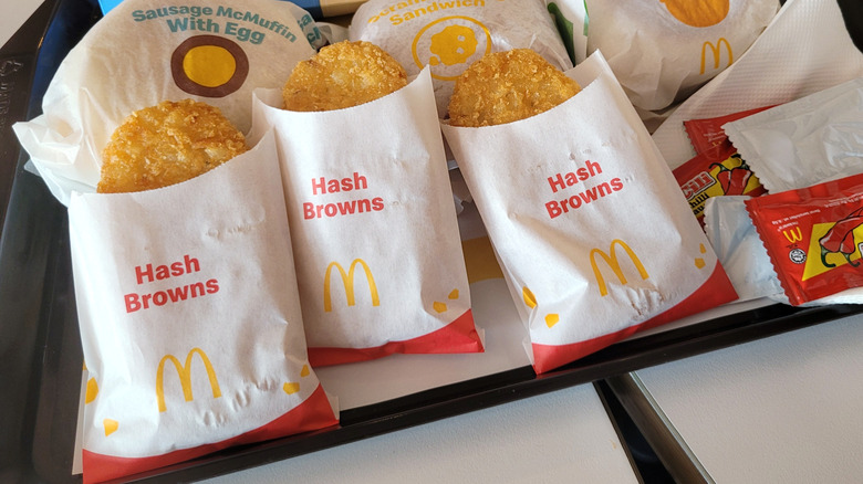 a row of McDonald's hash browns on tray
