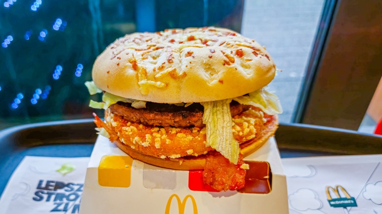 a McDonald's burger with meat, lettuce, and bacon