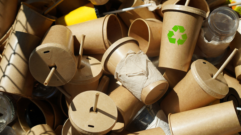 Recycled cups in a trash bin