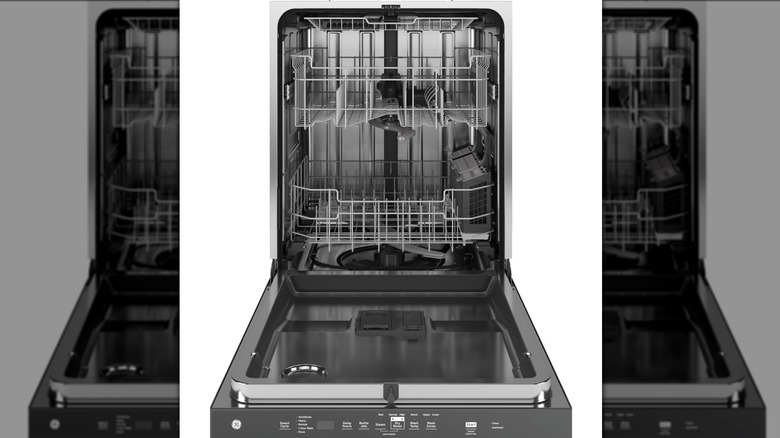 A dishwasher with an open door, revealing its interior racks.
