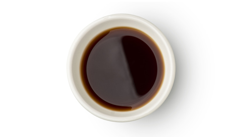 white bowl of soy sauce