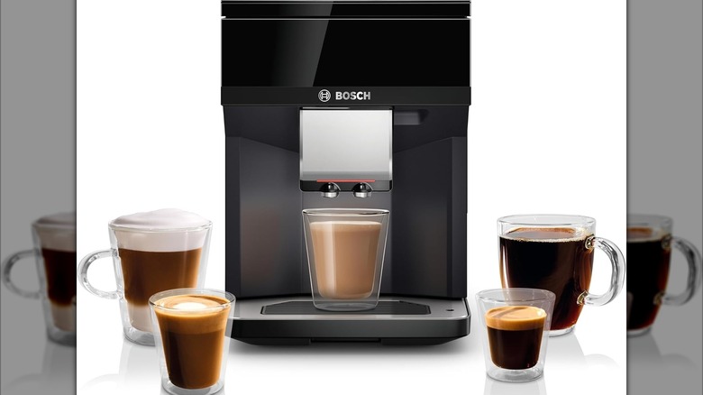 A bosch espresso machine with five cups of different-style espressos