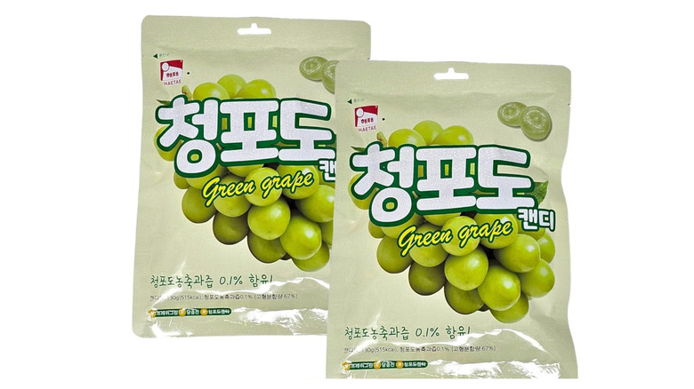Two bags of grape candy against white background