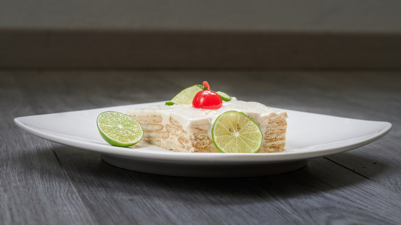 A slice of carlota lime cake on a plate